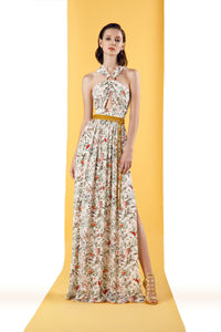 long floral dress with one slit, buckle detail creating the gathering in the front