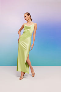 long green slip on with asymmetrical cuts and a slit 